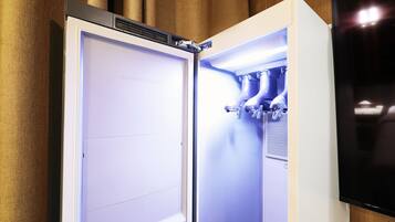 A modern kitchen with a built-in refrigerator, a microwave, and a stove.