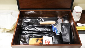 A wooden box containing toiletries and a toothbrush. - Stay25 (Seongnam)