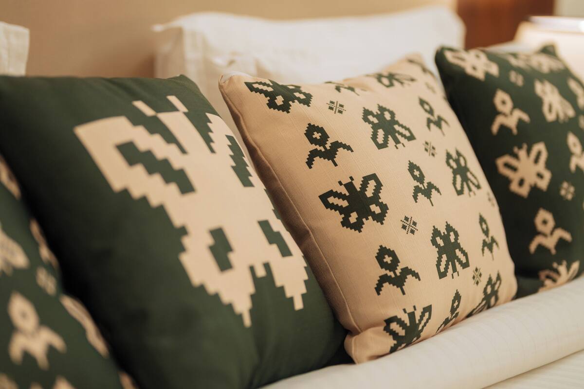 A sofa with patterned cushions.