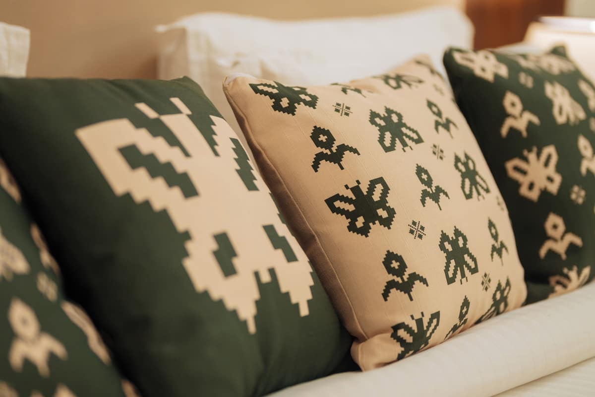 A sofa with patterned cushions.
