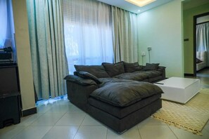 Living area - Cozy 1-bedroom apartment in serene Kampala, price is negotiable (Kampala)