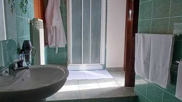 Family Triple Room | Bathroom | Shower, free toiletries, hair dryer, slippers
