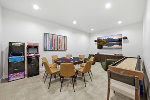 A room with a pool table, a dartboard, a gaming console, a painting, and a television. - Sauna + Cold Plunge + Game Room | Jordanelle Views | Serenity Now (Hideout)