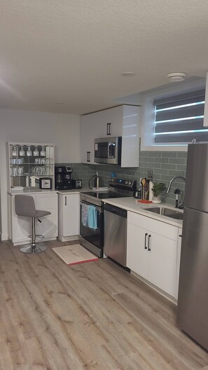 Fridge, microwave, oven, stovetop - Charming 1-Bedroom Basement Suite in Spruce Grove, Alberta (Spruce Grove)