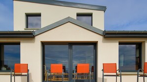 A modern building with large windows and a flat roof.