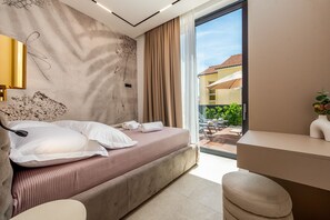 A modern bedroom with a bed, bedside table, and a view of the outside. - Villa Marro Zadarvillas (Privlaka)