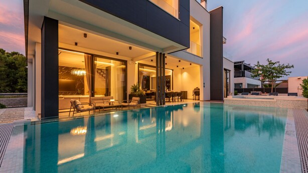 A modern house with a swimming pool, large windows, and outdoor seating. - Villa Marro ZadarVillas (Privlaka)