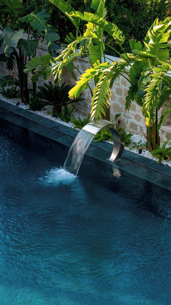 Outdoor pool, open 9:00 AM to 7:00 PM, pool umbrellas, pool loungers