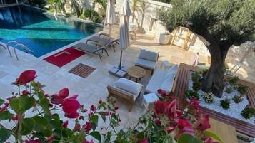 Outdoor pool, open 9:00 AM to 7:00 PM, pool umbrellas, sun loungers