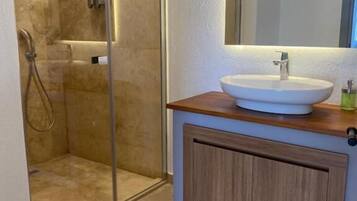 Shower, free toiletries, hair dryer, slippers