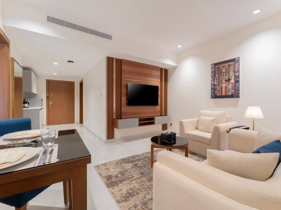 Family Suite, Sea View | Living area | 43-inch TV with satellite channels