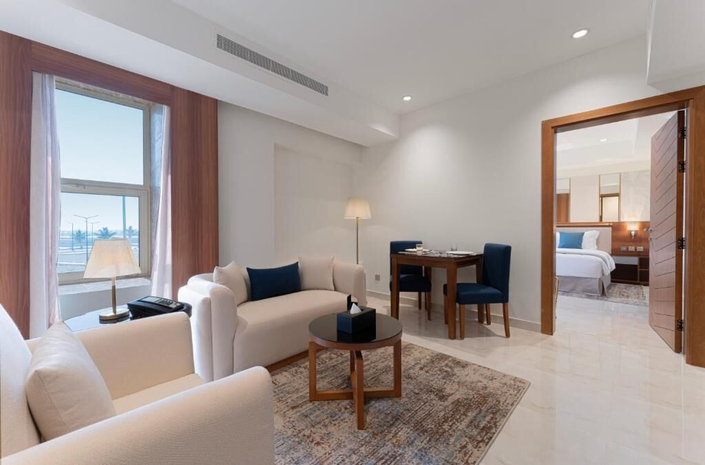 Family Suite, Sea View | Living area | 43-inch TV with satellite channels