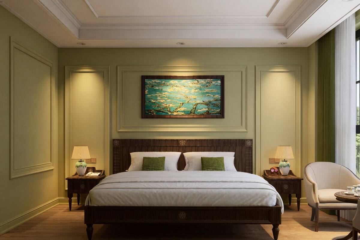 A hotel room with a large bed, two bedside tables, a chair, and a painting on the wall.