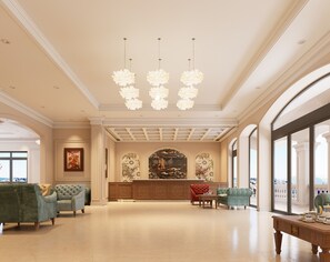A spacious lobby with a grand chandelier, comfortable seating, a reception desk, and large windows offering a view. - Dalabiang Hotel (Da Lat)