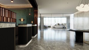 A modern reception area with a marble floor, a reception desk, and a car parked in the background. - BRISDALE INTERNATIONAL KUALA LUMPUR (Kuala Lumpur)