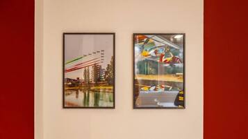 Two framed artworks on a wall.
