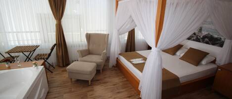 Suite, Partial Sea View | Desk, laptop workspace, free WiFi, bed sheets
