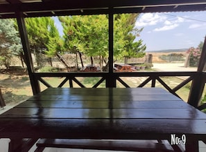 Comfort Triple Room, Garden View | Outdoor dining