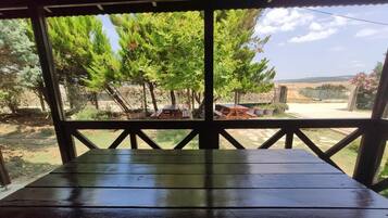 Comfort Triple Room, Garden View | Outdoor dining