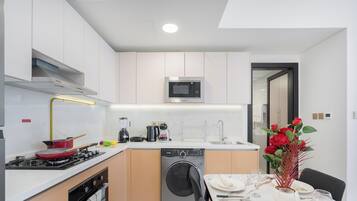 Deluxe Apartment, Balcony, City View | Private kitchen | Electric kettle, toaster, highchair, freezer