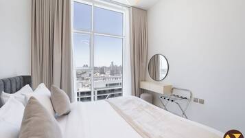 Deluxe Apartment, Balcony, City View | Premium bedding, in-room safe, individually decorated