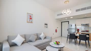 Appartement Deluxe, balcon, vue ville | Coin séjour