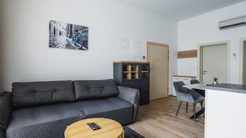 Apartment (Modern Apartment Near The Sea) | Living room | 32-inch flat-screen TV with cable channels