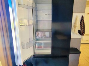 A refrigerator with multiple shelves and a freezer compartment. - Calm lodge near port - 6 guests (Canet-en-Roussillon)