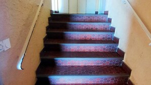 A staircase with a hexagonal tile pattern on the steps. - Studio sea view, parking and air conditioning (Canet-Plage)