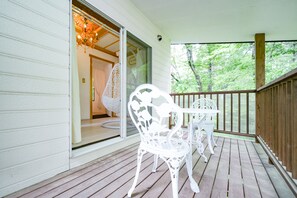 A wooden deck with white outdoor furniture, including a table and chairs. - HAJIMARINOYADO D'LL (Tsumagoi)