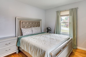 A bedroom with a bed, a nightstand, a window with curtains, and a view of the outside. - 5 Mi to Dtwn Harrisburg! Retreat w/ Spacious Yard (Harrisburg)
