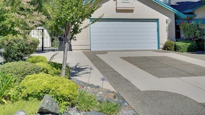 A residential house with a garage, a driveway, and landscaped garden. - 5 Mi to Sundial Bridge & River! Pet-friendly Haven (Redding)
