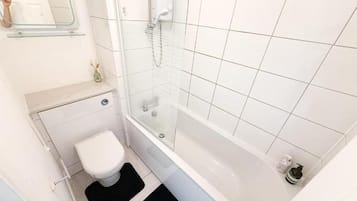 Combined shower/bathtub, deep-soaking bathtub, hair dryer, towels