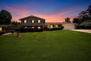 A two-story house with a well-maintained lawn, a garage, and a driveway. - Private Pool Oasis 15 Mins To World Cup Sleeps 10 4 Bedroom Home (Decatur)