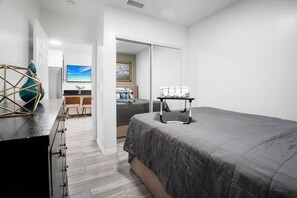 A modern bedroom with a bed, a desk, and a chair. - Private Cozy Guest House w/ Parking Slps 4 (Santa Clarita)