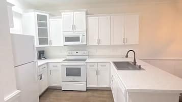 Coffee/tea maker, fridge, microwave, oven
