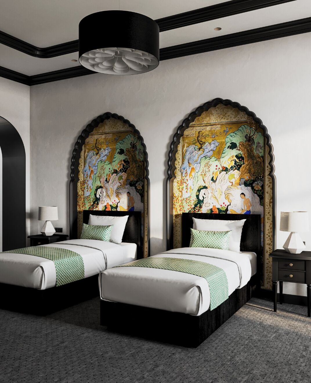 A hotel room with two beds, a large mural on the wall, a black ceiling light, and a small table with a lamp.