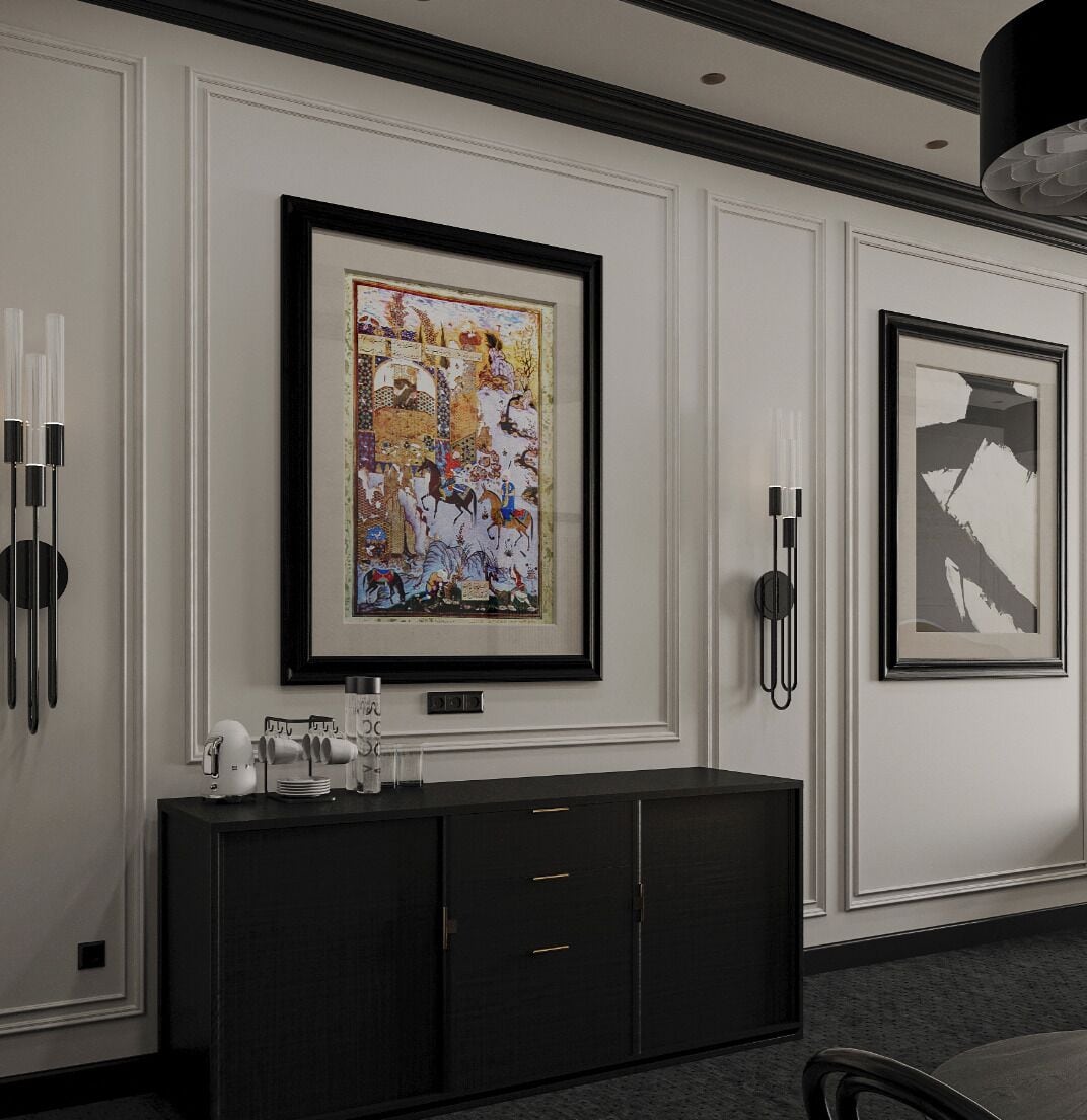A hallway with framed artwork on the walls, a dark wooden console table with a coffee machine, and a black telephone.