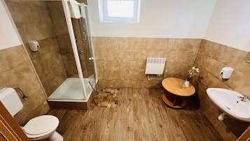 Classic Triple Room, Courtyard View | Bathroom | Shower, towels, toilet paper
