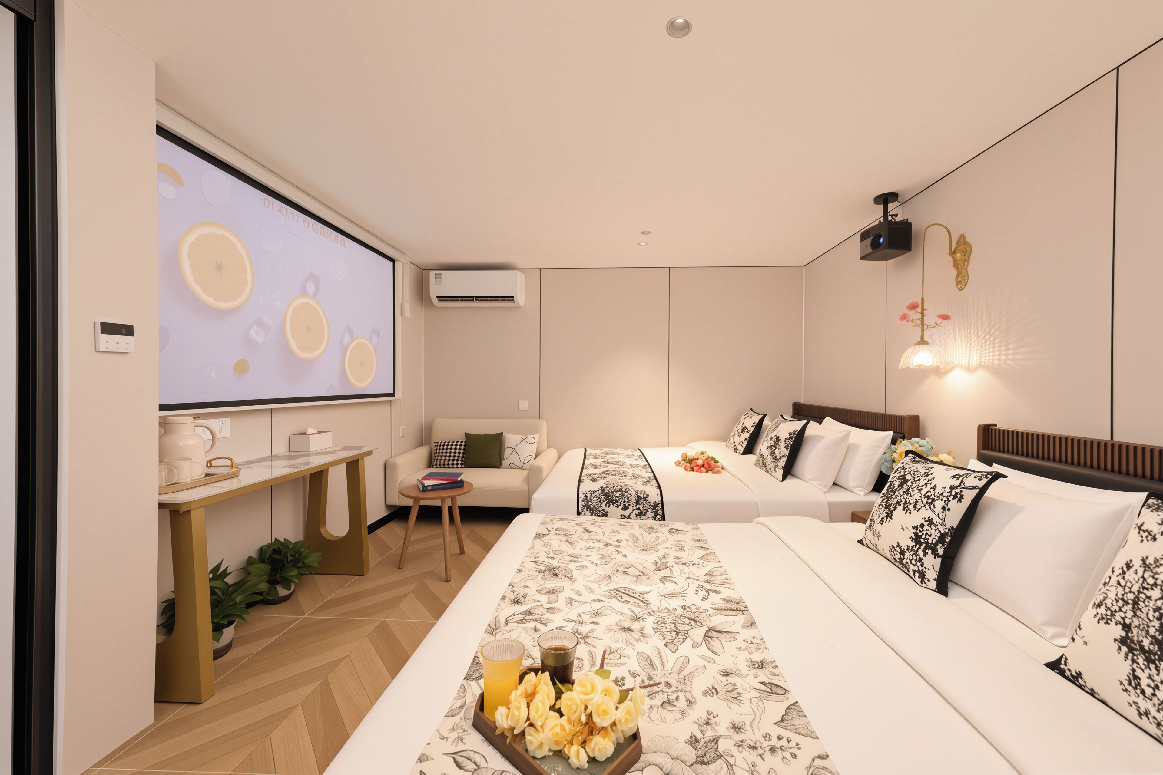Una habitación de hotel moderna con una cama grande, un escritorio, un sofá y una pantalla de televisión.