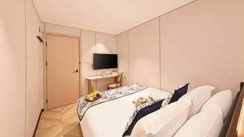 A modern hotel room with a bed, a desk, a flat-screen TV, and a door.