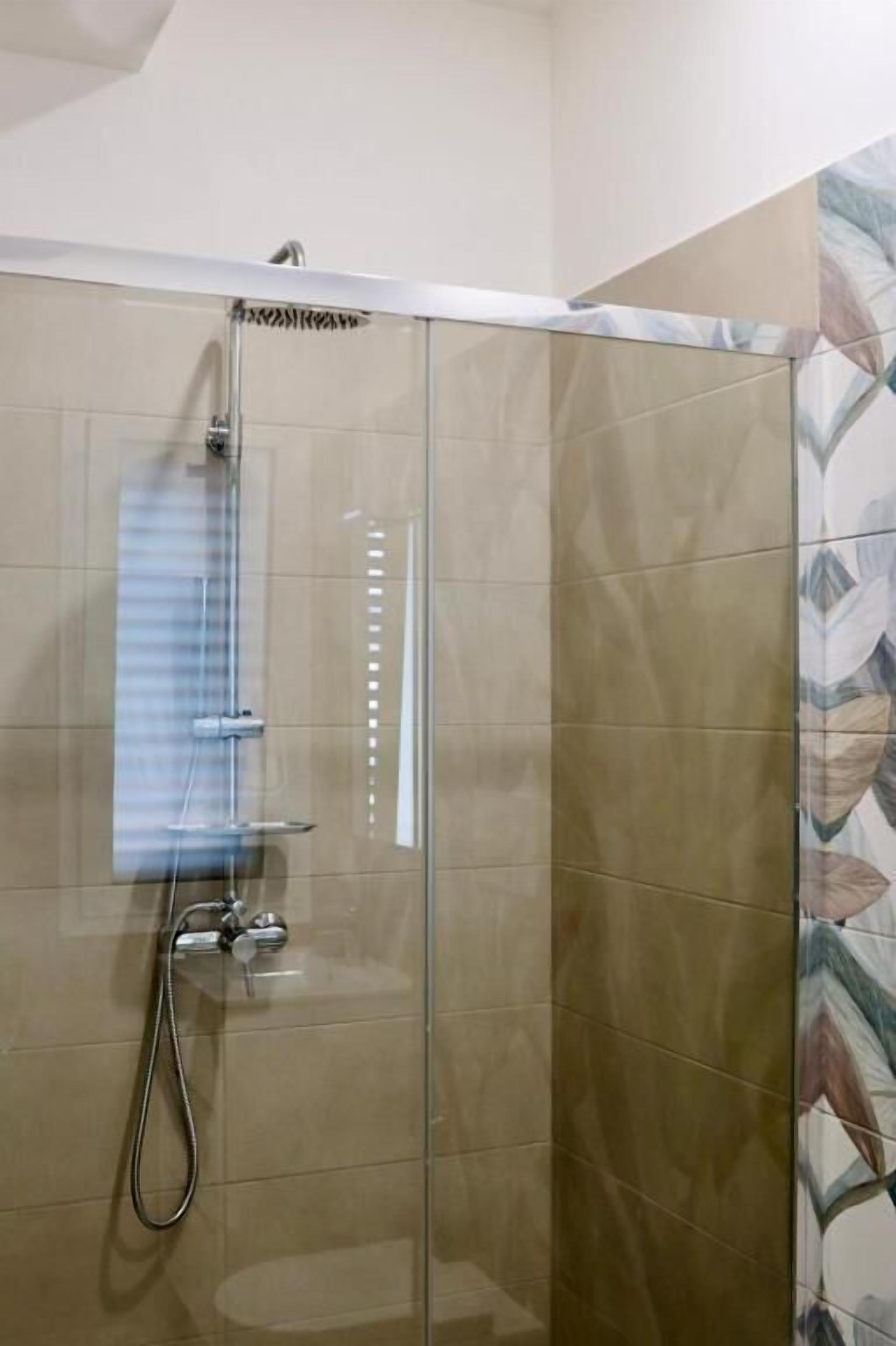 Double Room, Balcony, Beach View | Bathroom | Shower, hair dryer, towels, soap