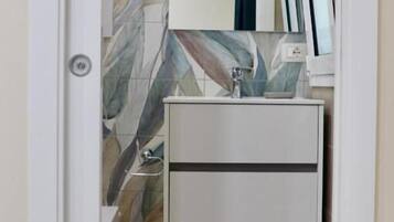 Double Room, Balcony, Beach View | Bathroom | Shower, hair dryer, towels, soap