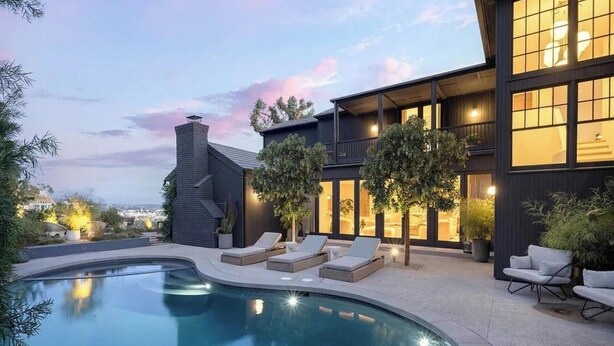 A modern house with a swimming pool, lounge chairs, and a large windowed balcony. - Sunset Manor - Designer Gated Estate Above Sunset Strip | Panoramic LA Views (Los Angeles)