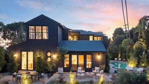 A modern two-story house with a swimming pool, outdoor seating, and a well-lit patio area. - Sunset Manor - Designer Gated Estate Above Sunset Strip | Panoramic LA Views (Los Angeles)