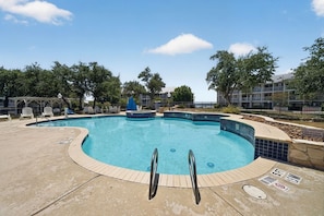 A swimming pool with a tiled edge, a lifeguard stand, and a no-jumping sign. - Relaxing 2 bd w/AC, Wi-Fi, pool Canyon Lake #424 (Canyon Lake)
