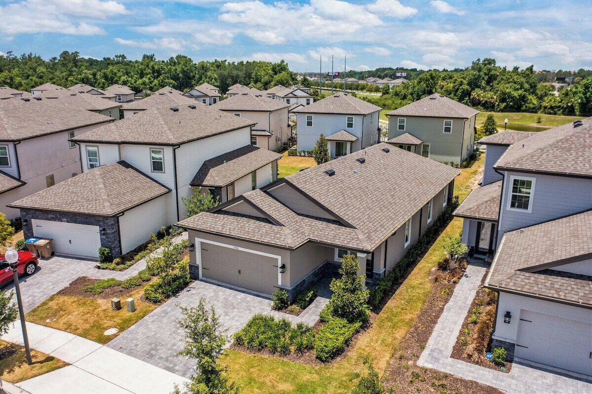 A residential area with multiple houses, each with a garage and a driveway.