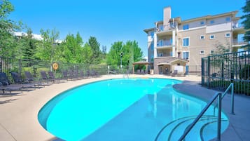 Seasonal outdoor pool, pool umbrellas, pool loungers