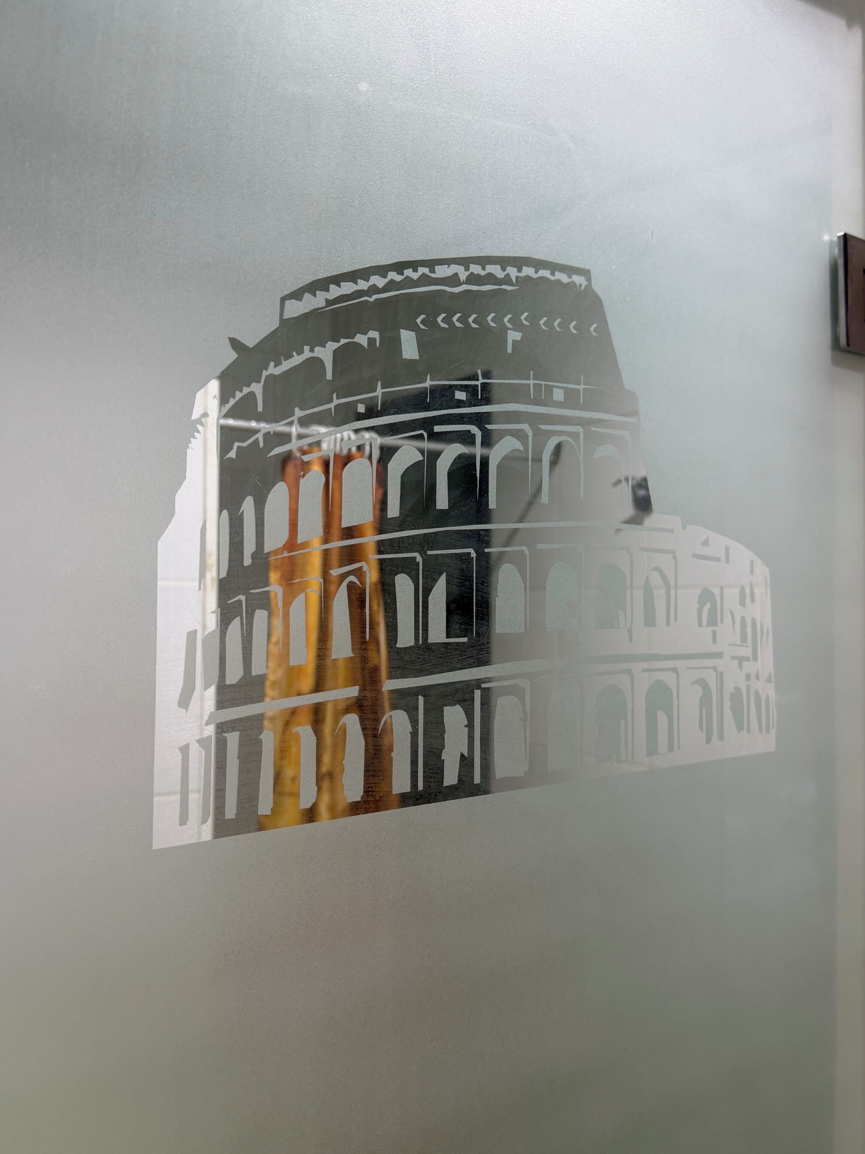 A wall with a cut-out of the Colosseum.