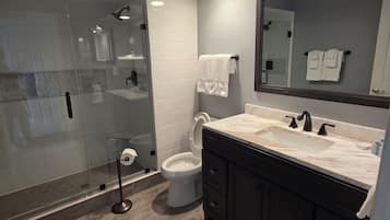 Shower, hair dryer, towels, soap